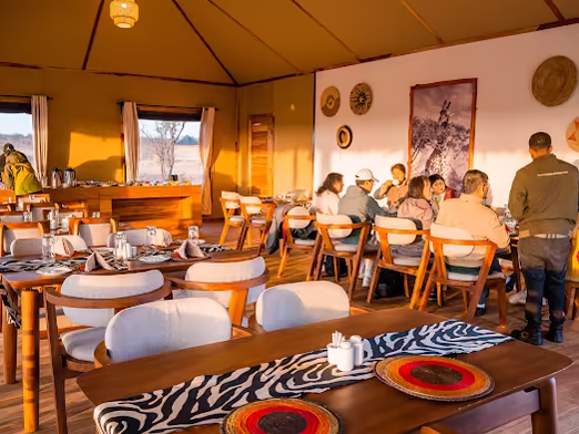 Guests at dinner in the camp dining tent