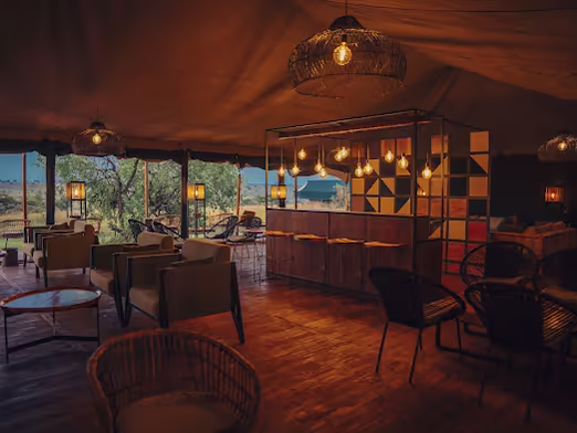 Main tent lounge and dining area at night
