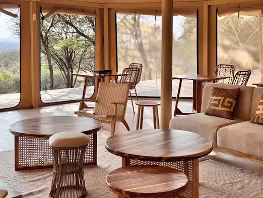 Lounge with round tables and wicker chairs